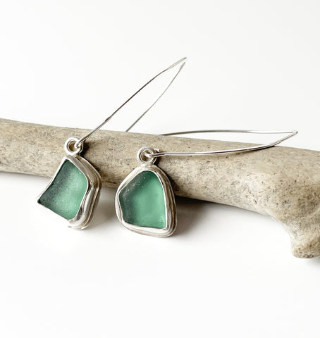 Green sea glass dangly earrings